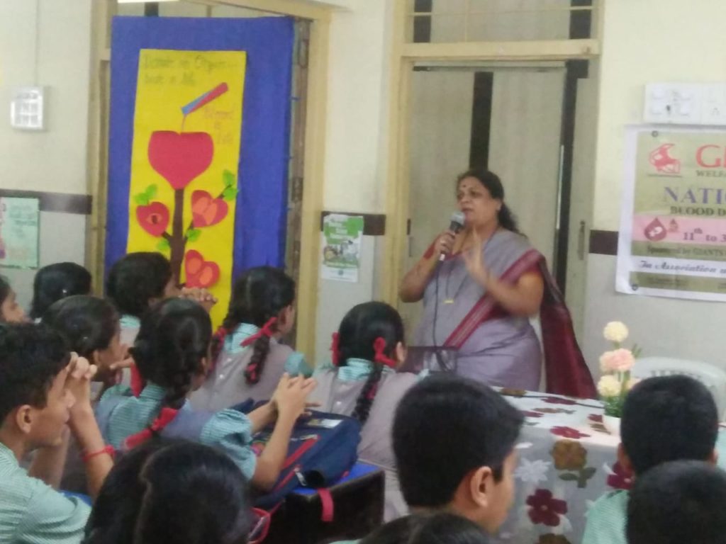 Ms. Meera Suresh talking to std. IX about Blood & Organ Donation