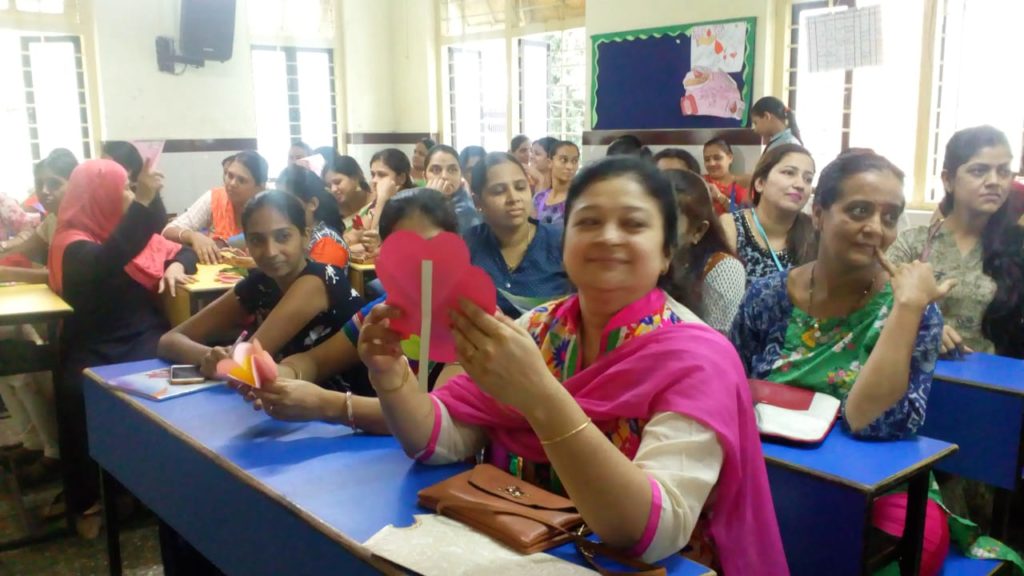 Mothers reading letters at Sharon School Mulund