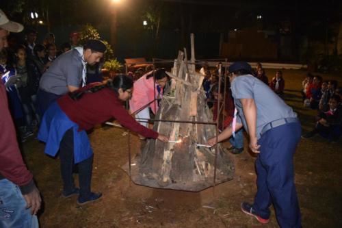 Sharon Scouts and Guides Masters lighting the Campfire at the Scouts   Guides Camp site, Lonavala