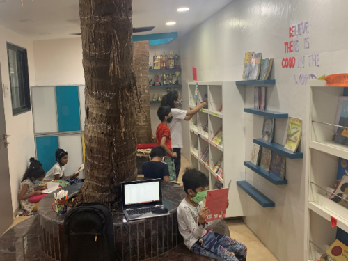 Children browsing and borrowing in the library 2